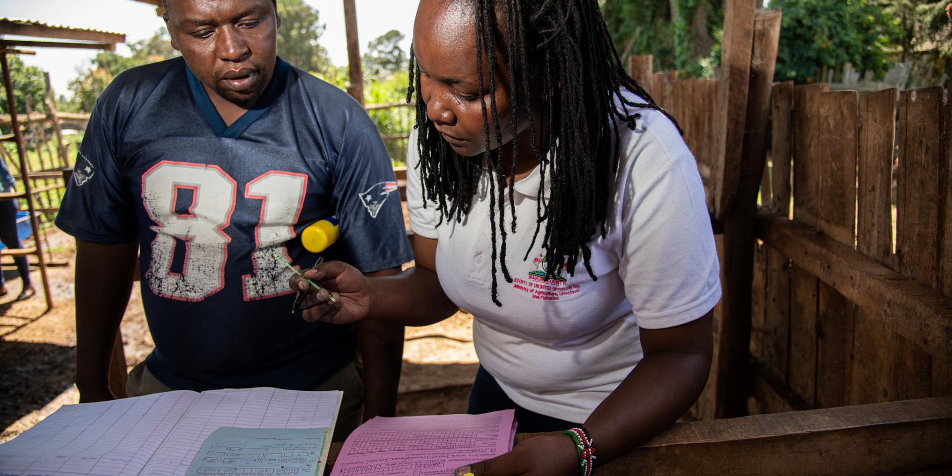 Dairy entrepreneur John Ngasha with Lydia Kimachas from the Ministry of Agriculture, Livestock and Fisheries, Nakuru, Kenya. Photo: Georgina Smith/ILRI.