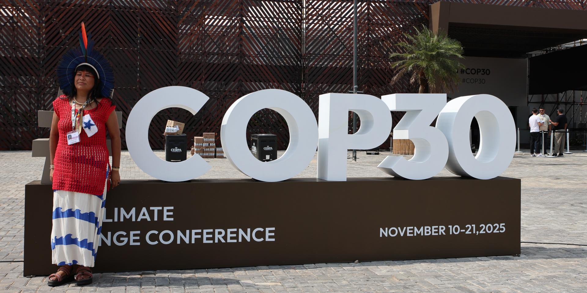 A participant outside the COP30 venue in Belem, Brazil