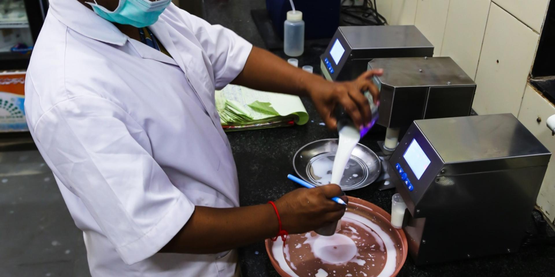 Man working on milk production