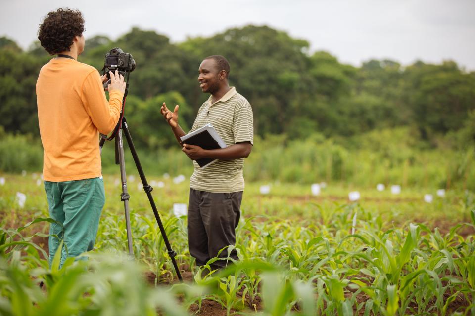 IFPRI Videographer Milo Mitchell records a video interview in an experimental maize field with a Trans-SEC researcher in Kilosa, Tanzania. 
