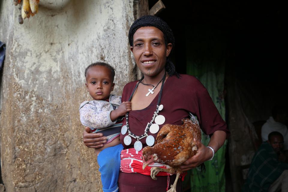 Teje Kassa, Agriculture to Nutrition (ATONU) project beneficiary with her son