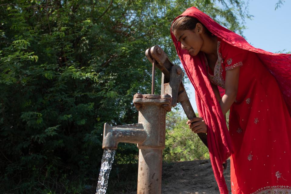 Fetching water from a hand pump