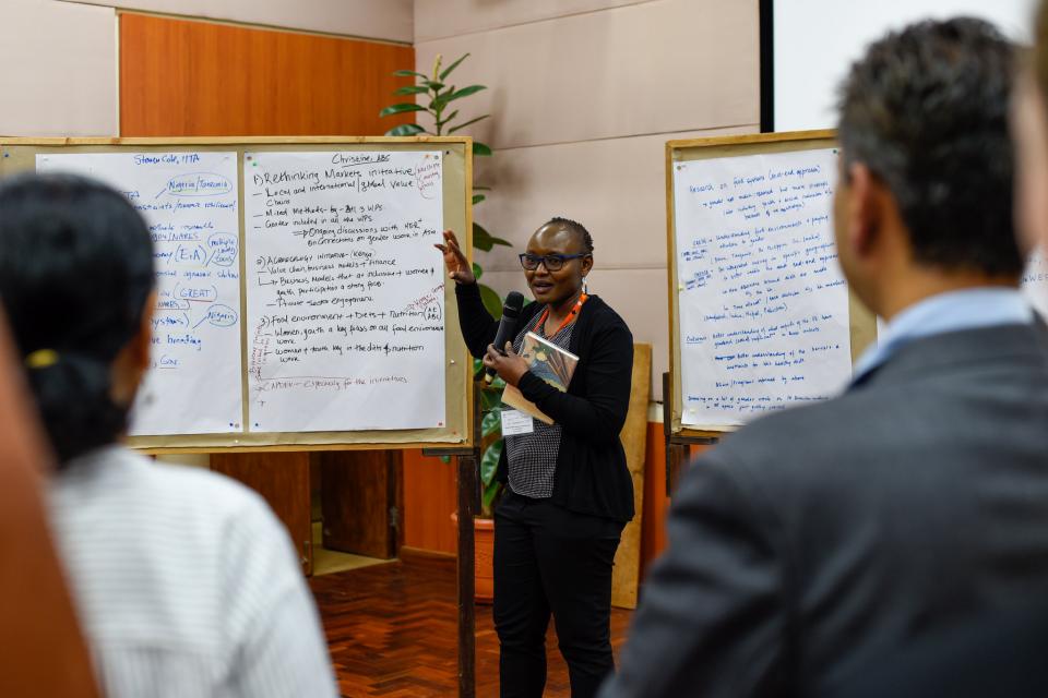 A gender researcher presents to colleagues