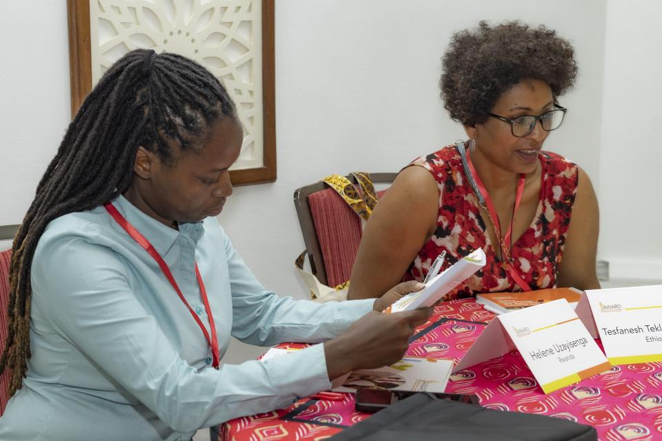 From left: 2023 AWARD Policy Fellows Helene Uzayisenga and Tesfanesh Tekehaymanot from Rwanda and Ethiopia, respectively, during an ongoing session at the Women's Leadership and Management Course held from October 8-14, 2023, in Mombasa, Kenya     Photo credit: AWARD/ Abraham Ali photography