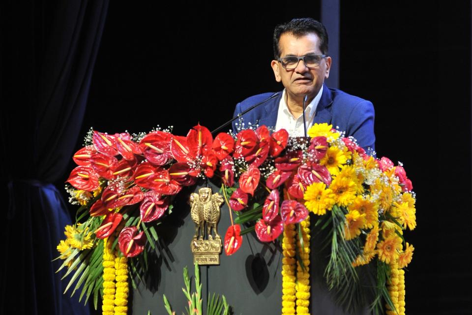 Amitabh Kant standing at lectern