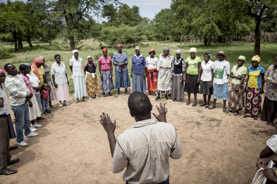 District field officer talks to a group of women