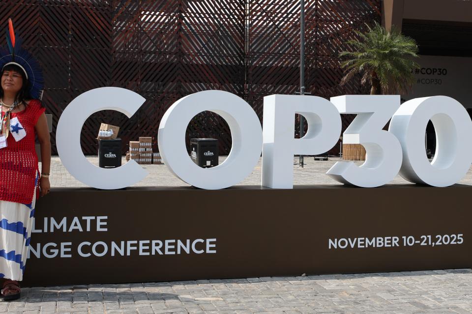 A participant outside the COP30 venue in Belem, Brazil