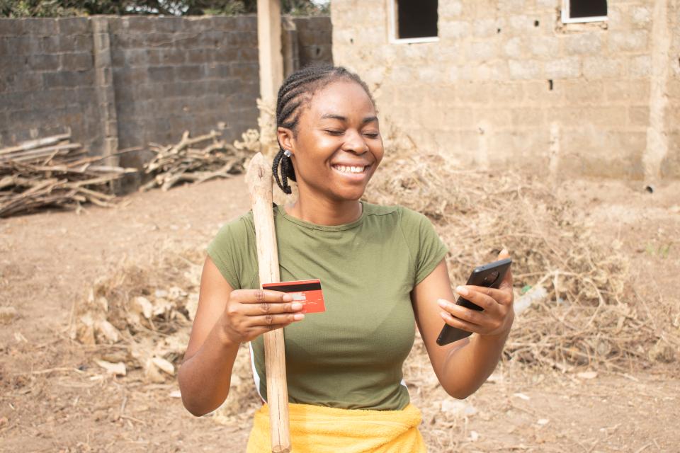 lady holding card and phone